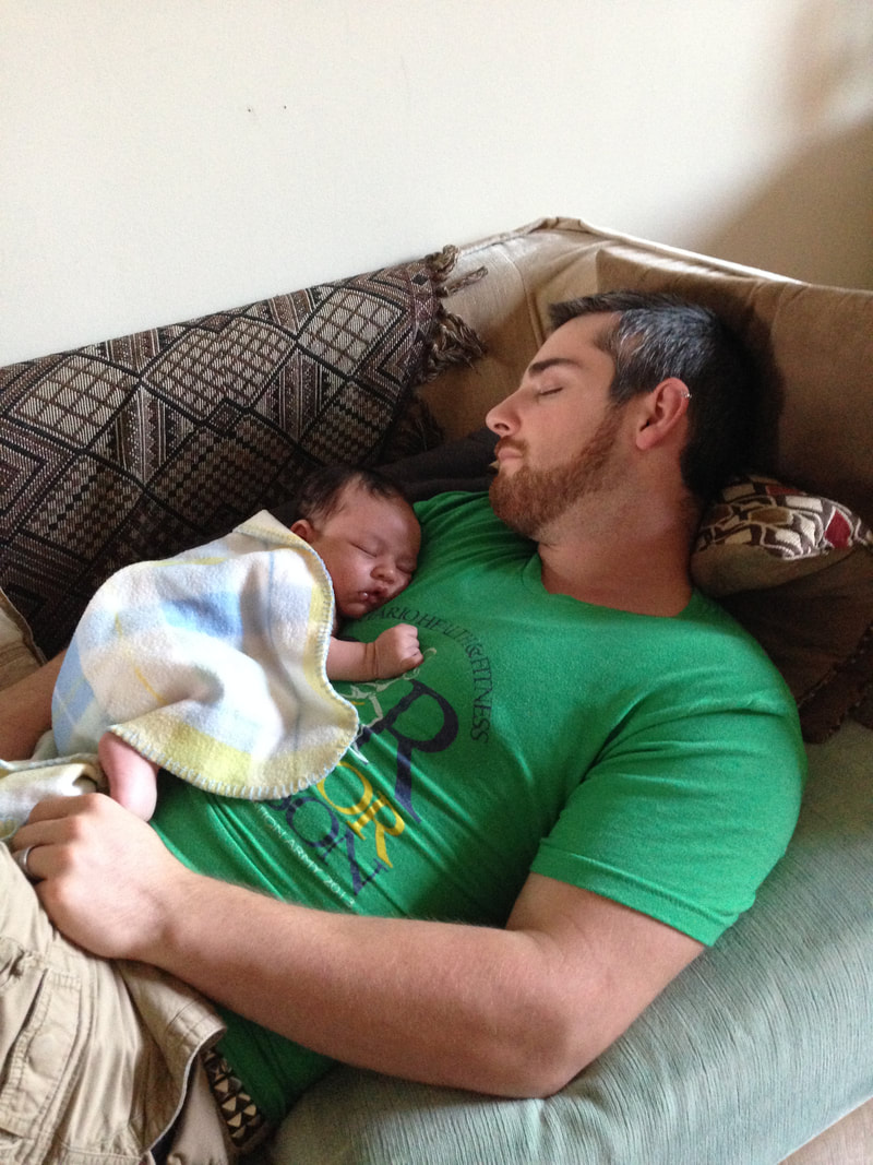 Mitch and newborn Emmanuel sleeping